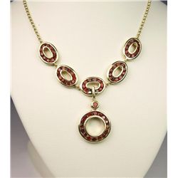 Stylish Contemporary Red Garnet Necklace with 65  channel set red/orange Garnets weighing approx.  5
