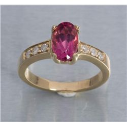 One ladies ring made in 14k yellow gold set with a  3.55ct oval Rubellite (pink tourmaline) and 6  d