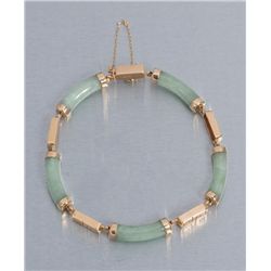 One well crafted jade and 14 k yellow gold link  bracelet .  Est.:  $750 - $1,000