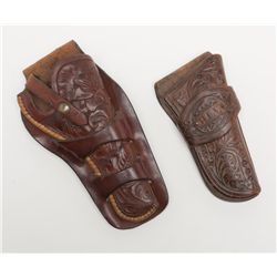 Lot of 2 tooled leather holsters, both pre-War and  both in very good condition; one is a V.L. & A.,