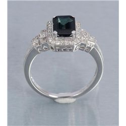 One 14k white gold ladies ring set with an emerald  cut sapphire weighing approx 2.5ct and 0.38ct of