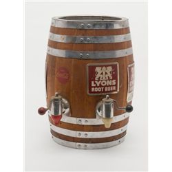 Old Lyons Root Beer Machine, approx. 23” in height  and 16” in diameter, barrel shape, in wood with