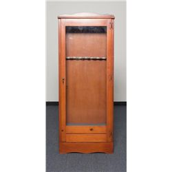 Custom 7 gun cabinet with a reddish stain in very  good condition, approx. 66” x 26” x 11” overall;