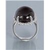 Image 2 : One white gold ring set with a large Smokey topaz  cabochon weighing approx.    30.00 cts.  Est.: