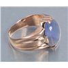 Image 4 : One mans ring in 18k yellow gold set with a  approx. 8 ct light blue sapphire cabochon with a  hint