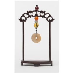 Lot including misc. jade earrings, a small jade  duck on a stand and a small decorative jade  hangin