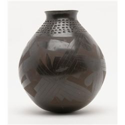 Large black ware pot with incised Indian  decoration signed Nikola Silvera. Measures  approximately