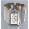 Image 1 : One unique ladies 2” wide wrist watch with a  rectangle face and roman numerals could be silver.   E
