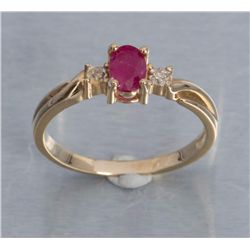 One 14 k yellow gold ring set with oval ruby and  diamonds.  Est.:  $150 - $200