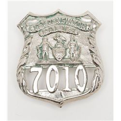 Lot of 2 police badges including a City of New  York, #7010 and a Nassau County, New York, #1589,  b