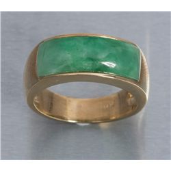 One mans ring in 14k yellow gold set with a custom  cut green jade.  Est.:  $1,000 - $1,500