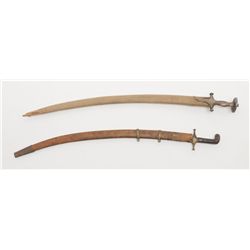 Lot of 2 Mid-Eastern style blades with scabbards;  first, one approx. 34” overall with small brass