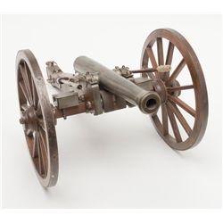 Finely constructed example of a mid-1800’s field  cannon on wooden carriage, approx. 27” long, 17”