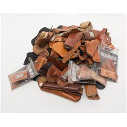 Lot of misc. holsters for a variety of makes and  models of revolvers and pistols, mostly leather  a