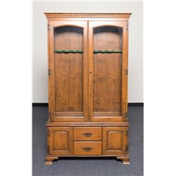 Wood gun cabinet, approx. 54” in height, 42” wide  and 13” deep with two wood framed glass doors;  b