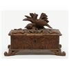 Image 1 : Small black forest style antique carved wooden box  with game birds; old damage to front lid edge.