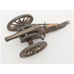 Older reproduction Dahlgren cannon on carriage  approximately 11 1/2” x  4 1/2” cast metal and  plas