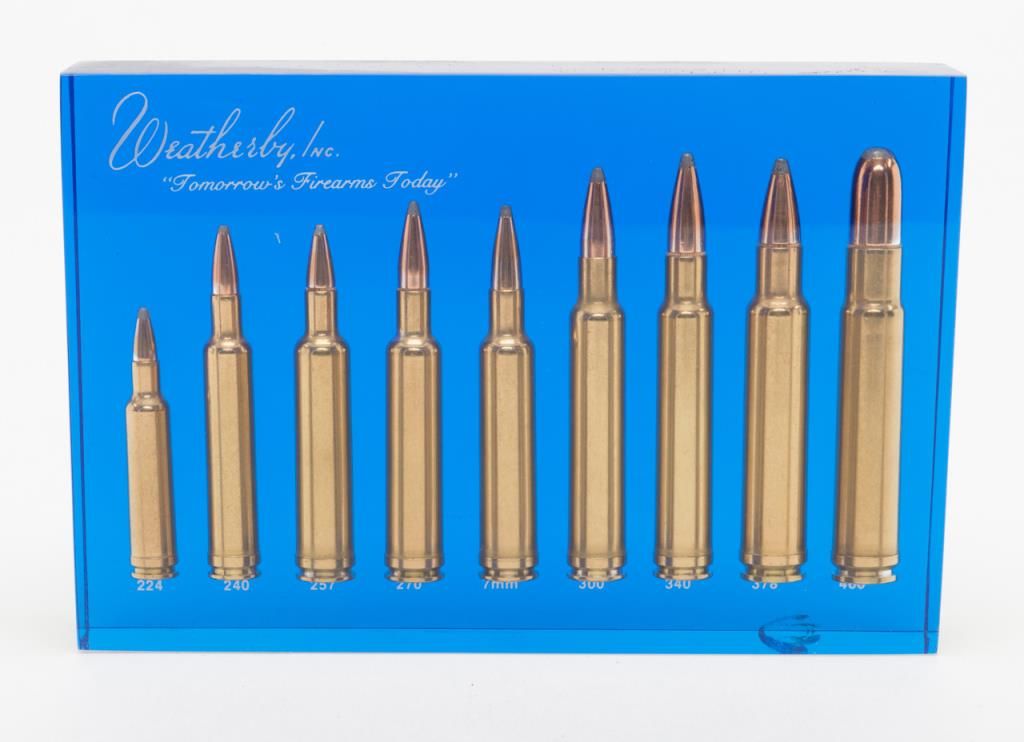 Weatherby Cartridge display in Lucite block; 9 cartridges ranging in