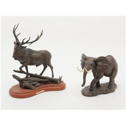 Lot of two non-metallic cast artworks. Number 1  shows bull elk bugling entitled “Wilderness Song”