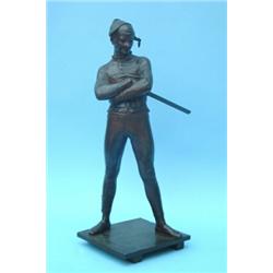 St Marceux, a bronze figure of a masked harlequin standing on a naturalistic plinth, signed and d...