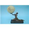 Image 1 : An Art Deco table lamp in the form of a bronzed figure of a semi-naked young woman, supporting a...