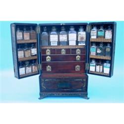 A good Regency mahogany apothecary's cabinet, inlaid with cut-brasswork and having countersunk ca...