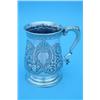 Image 1 : A George II silver baluster mug with scroll handle on circular spreading base, with later floral...