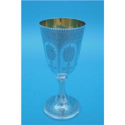 A Victorian silver chalice with bright-cut floral-engraved decoration on knopped stem and circula...