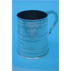 A Victorian silver mug of tapering form with scroll handle to triple-banded body on moulded base,...