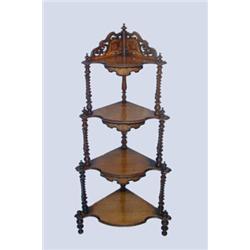 A Victorian walnut corner whatnot, marquetry inlaid with pierced gallery over shaped shelving and...