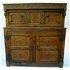Image 1 : An early 18th century oak press cupboard having carved cornice over recessed cupboard enclosed by...