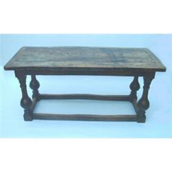 A 19th century Dutch elm refectory table having cleated planked top on baluster-turned supports w...