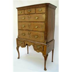 A George II walnut chest on associated stand having cavetto cornice over 3 short drawers and 3 gr...