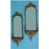 Image 1 : A pair of 19th century gilt wall mirrors, each having arched bevelled plate, in foliate frame ove...