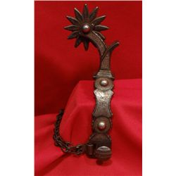 Single spur, engraved by Eddie Hulbert, marked E. H. under button