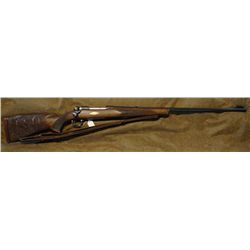 Win Model 70, .300 H & H, custom engraved, carved stock, sling, diamond ivory inlay, checkered wood.