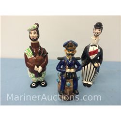 Three vintage figural liquor decanters