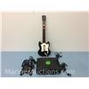 Image 1 : Xbox console with two controllers and guitar controller
