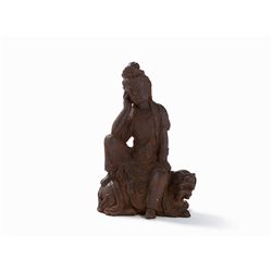 Cast Iron Figure of a Guanyin Seated on a Fo Lion, 18th/19th C.