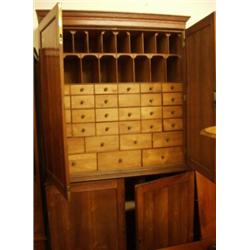 Oak four door estate cupboard with shaped pigeon holes and over thirty drawers…