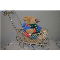 A large 1985 Bialosky Bear by Gund in a metal push sled