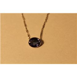 14 KT. WHITE GOLD NATURAL TANZANITE SLIDER STYLE PENDANT.  OVAL SHAPED BEZEL SET WITH 1 OVAL MIXED