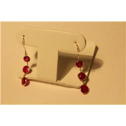 PAIR OF 14KT. YELLOW GOLD DANGLING RUBY EARRINGS SET WITH A TOTAL OF 6 ROUND MIXED CUT GLASS