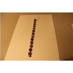 STERLING SILVER NATURAL BLUE SAPPHIRE, RUBY AND EMERALD SET BRACELET.  BEAD SET WITH 52 ROUND