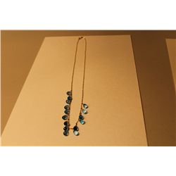 10 KT. YELLOW GOLD NATURAL BLUE TOPAZ BRIOLETTE NECKLACE SET WITH 15 NATURAL BLUE TOPAZ BRIOLETTES.