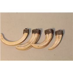 LOT OF 4 AFRICAN WARTHOG TUSK PENDANTS WITH SILVER FILIGREE