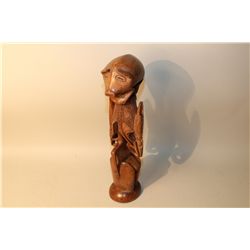 PAPAU NEW GUINEA PIG MAN CARVING 20" HIGH. DOUBLE-FACED FIGURE SURMOUNTED BY PIG, SYMBOL OF WEALTH