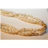 Image 2 : ONE LONG ROPE OF THREE STRANDS OF OVAL SHAPED WHITE FRESH WATER CULTURED PEARLS ACCENTED BY A
