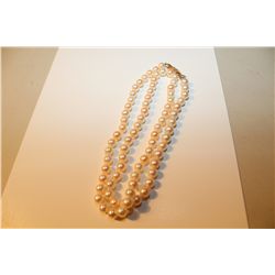 ONE STRAND OF ROUND WHITE JAPANSESE AKOYA CULTURED PEARLS KNOTTED TO A LENGTH OF APPROX. 61 CM WITH