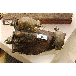 FOLK ART CARVING OF RACCOON'S ON LOG